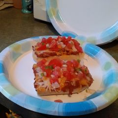 A picture of Molletes with Pico de Gallo.