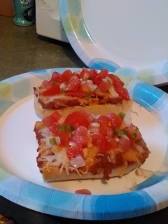 A picture of Molletes with Pico de Gallo.
