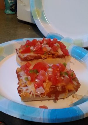 A picture of Molletes with Pico de Gallo.