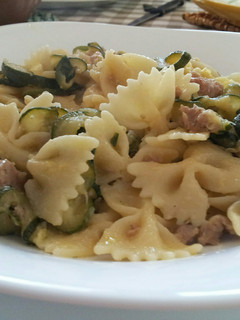 A picture of AMIEs Farfalle with Zucchini, Cream & Sausage.