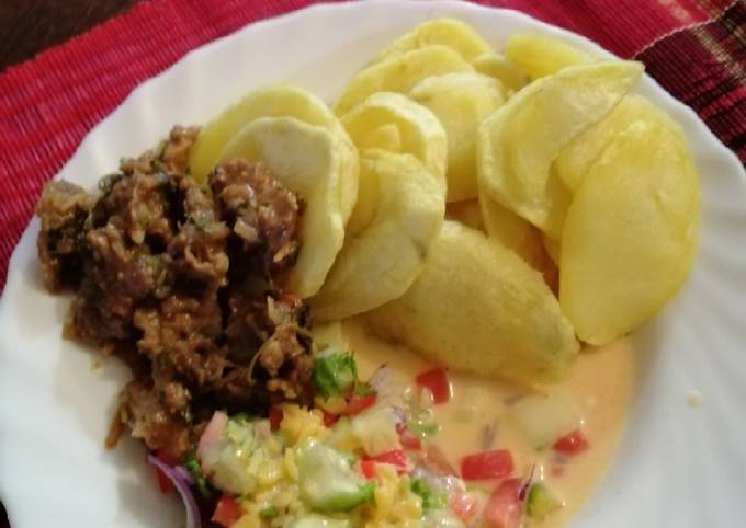 Roasted potatoes, kachumbari in castor milk and fried beef