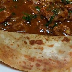 A picture of Stewed Beef served with chapati.