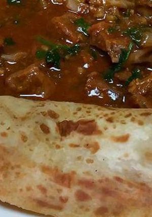 A picture of Stewed Beef served with chapati.