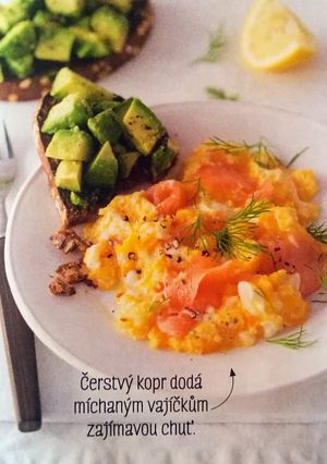 A picture of Scrambled eggs with smoked salmon and avocado toast.