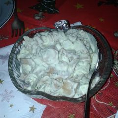 A picture of Mushrooms salad with mayo.