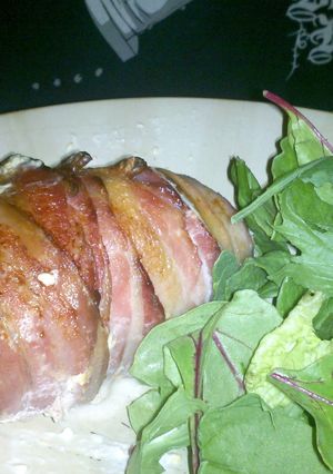 A picture of Bacon wrapped stuffed chicken breast.