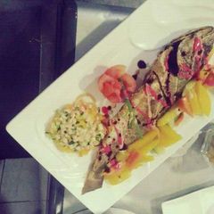 A picture of Grilled fish,irish potatoes chips.