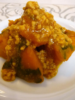 A picture of Simmered Chicken Soboro and Kabocha Squash.