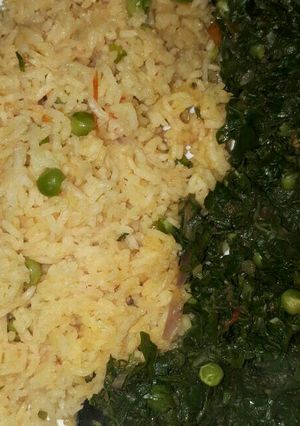 A picture of Vegetable rice served with spinach and peas.