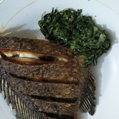 A picture of Greens with fish.