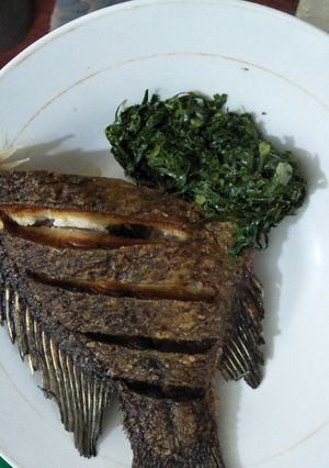 A picture of Greens with fish.