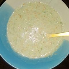 A picture of Rice and carrot puree.