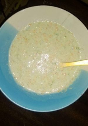 A picture of Rice and carrot puree.