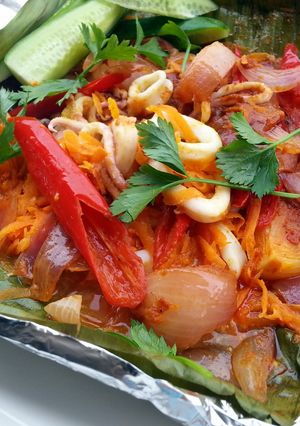 A picture of Baked Spicy Calamari / Squid (BANANA LEAF WRAP ).