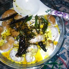 A picture of Dahi wada ( fried lentil balls in yoghurt).