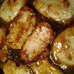 A picture of pork in apricot orange sauce.