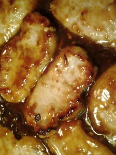 A picture of pork in apricot orange sauce.