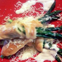 A picture of asparagus in a blanket,with tarragon sause.