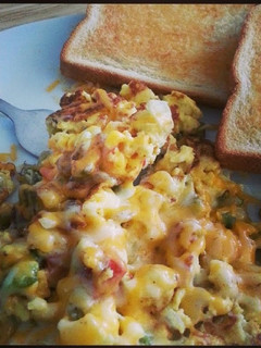 A picture of Cheesy Scrambled eggs.