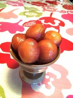 A picture of Honey Dipped Roly Poly Donuts with Pancake Mix.