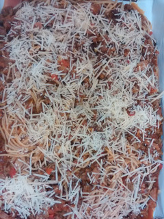 A picture of Baked Spaghetti with Parmesan cheese.