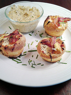 A picture of Baked Eggs in Corn Muffins with Sausage Cream Gravy Dipping Sauce.
