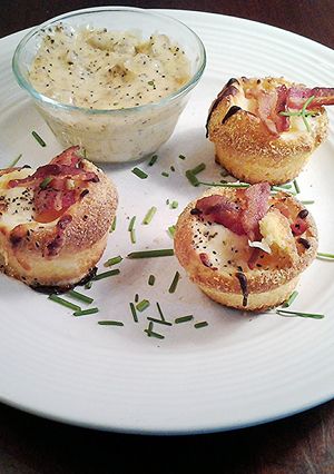 A picture of Baked Eggs in Corn Muffins with Sausage Cream Gravy Dipping Sauce.