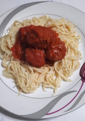 A picture of Meatballs in sauce.