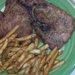 A picture of Baked Pork Steaks & Fries.