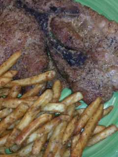 A picture of Baked Pork Steaks & Fries.