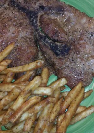 A picture of Baked Pork Steaks & Fries.