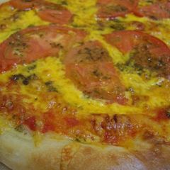 A picture of American Pizza with Basil Pesto.