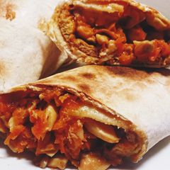 A picture of Vegetarian carrot mushroom omelette tortilla wrap.