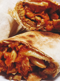A picture of Vegetarian carrot mushroom omelette tortilla wrap.