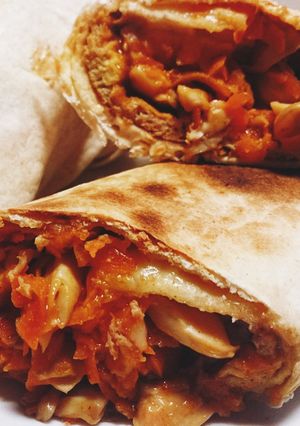 A picture of Vegetarian carrot mushroom omelette tortilla wrap.