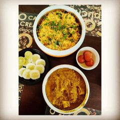 A picture of Fried Rice with Palak Paneer.