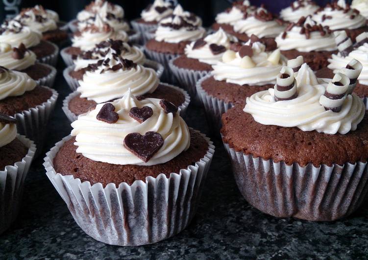 chocolate cupcakes with buttercream and chocolate toppings.