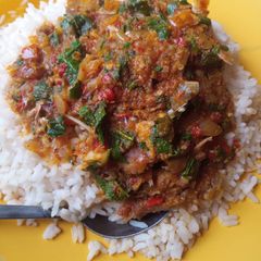 A picture of Garden egg sauce with basilica leaves.