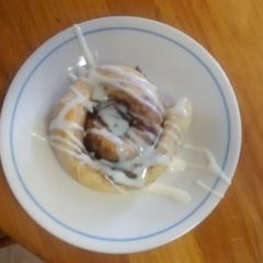 A picture of TL's Cinnamon Rolls with cream cheese icing.