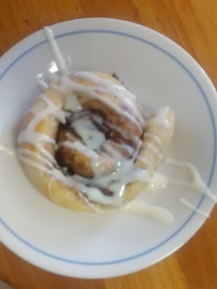 A picture of TL's Cinnamon Rolls with cream cheese icing.