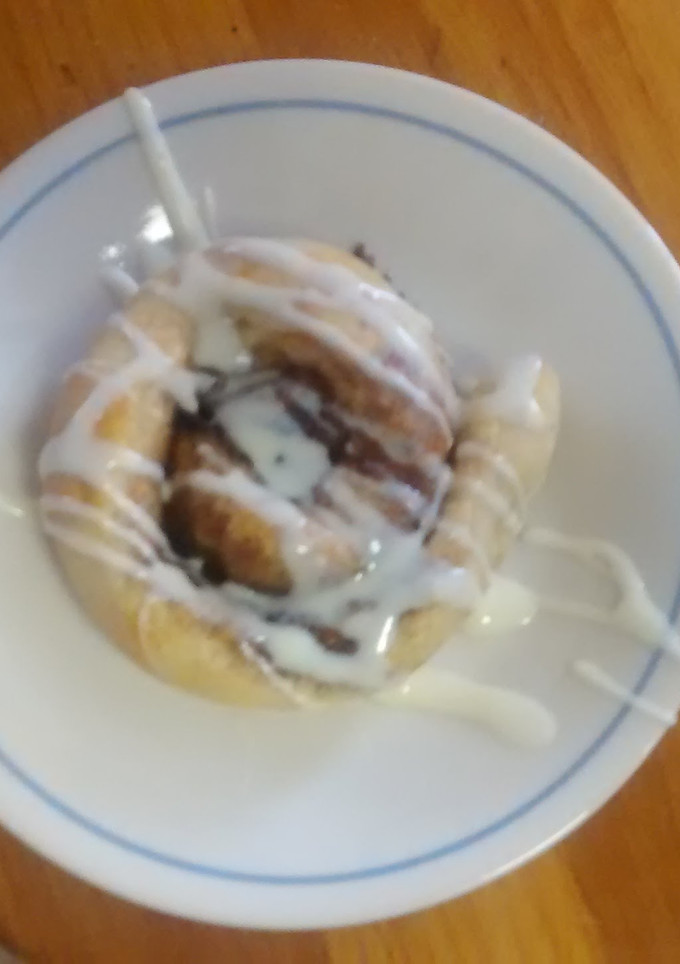 A picture of TL's Cinnamon Rolls with cream cheese icing.