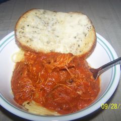 A picture of Chicken Sweet italian Sausage Spaghetti With Cheesy Sourdough Garlicbread.