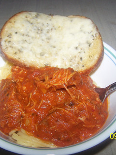 A picture of Chicken Sweet italian Sausage Spaghetti With Cheesy Sourdough Garlicbread.