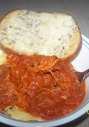 A picture of Chicken Sweet italian Sausage Spaghetti With Cheesy Sourdough Garlicbread.