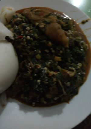 A picture of Okora soup and dry fish with Agidi.