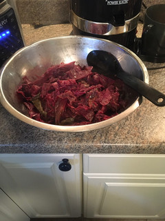 A picture of Red cabbage and apples.