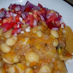 A picture of Spiced White runners beans in grated carrots.