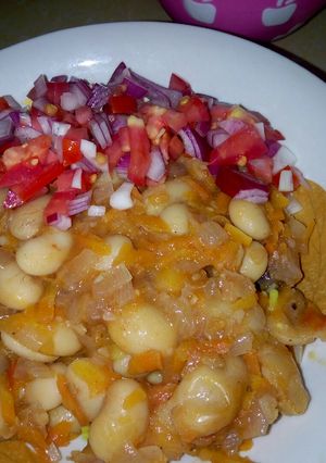 A picture of Spiced White runners beans in grated carrots.