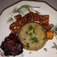 A picture of Native rice with plantain and turkey.