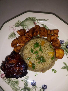 A picture of Native rice with plantain and turkey.